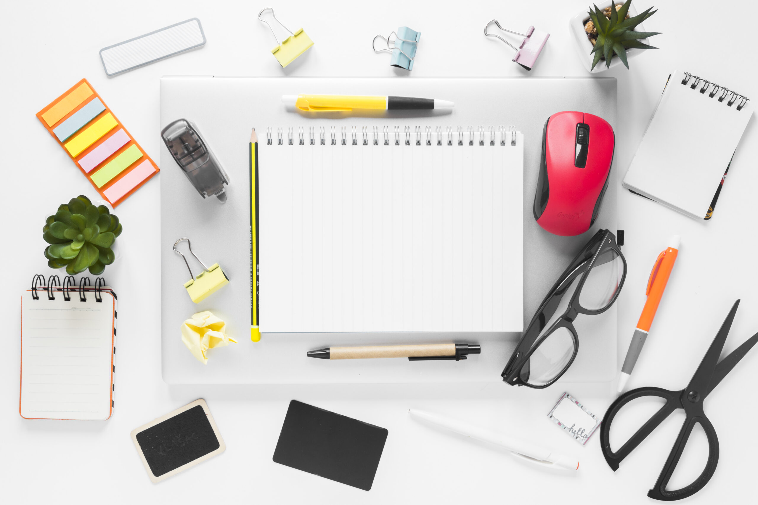 overhead view office stationeries laptop white background scaled